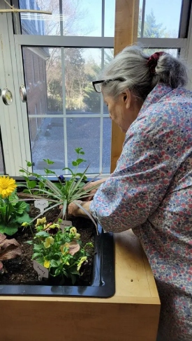 Resident Patricia embracing Eldergrow Therapeutic Horticulture Garden program launch